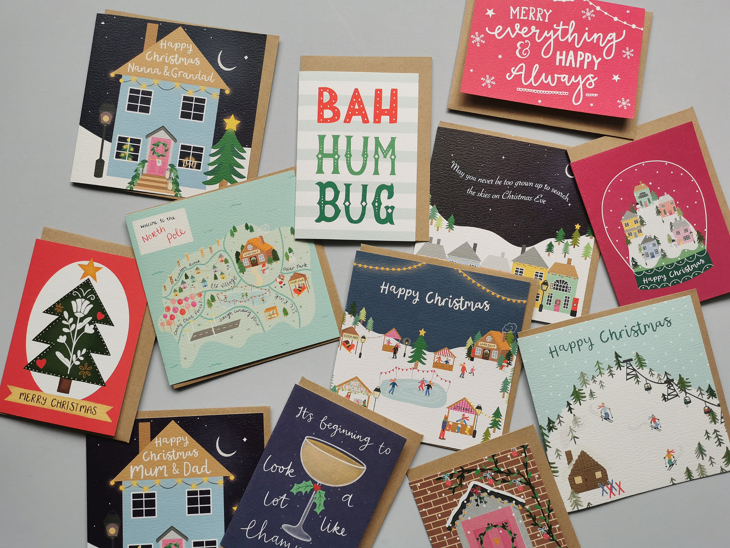 A flat lay of christmas greetings cards containing different illustrations.