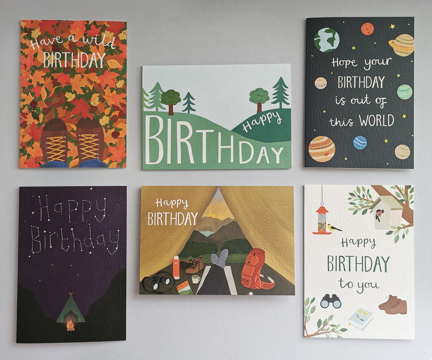 A flat lay of 6 birthday cards with an outdoorsy theme.  